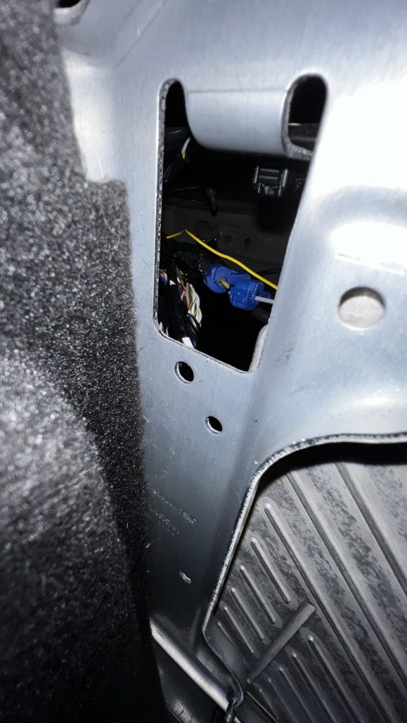 the grey wire at the amp, seen through removed trim