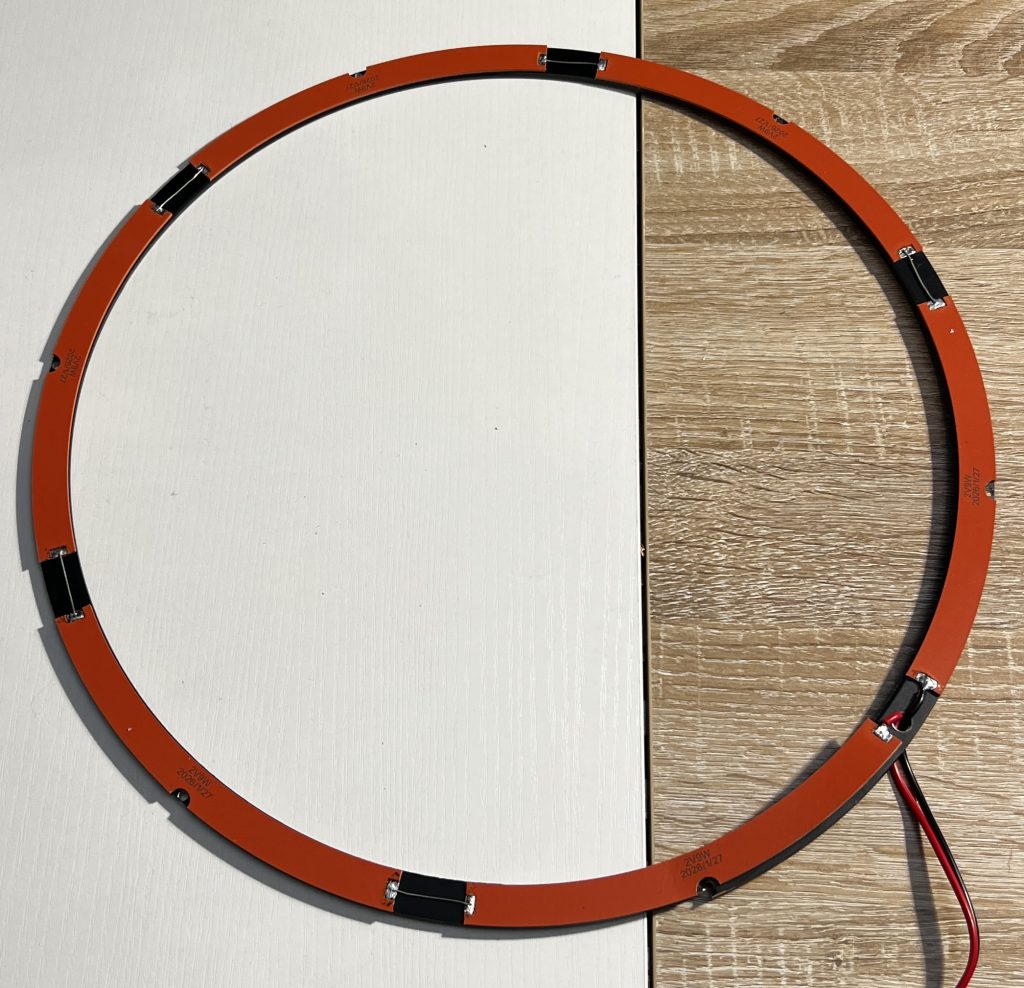 The split ring squeezed into position, leaving half of one arc unglued