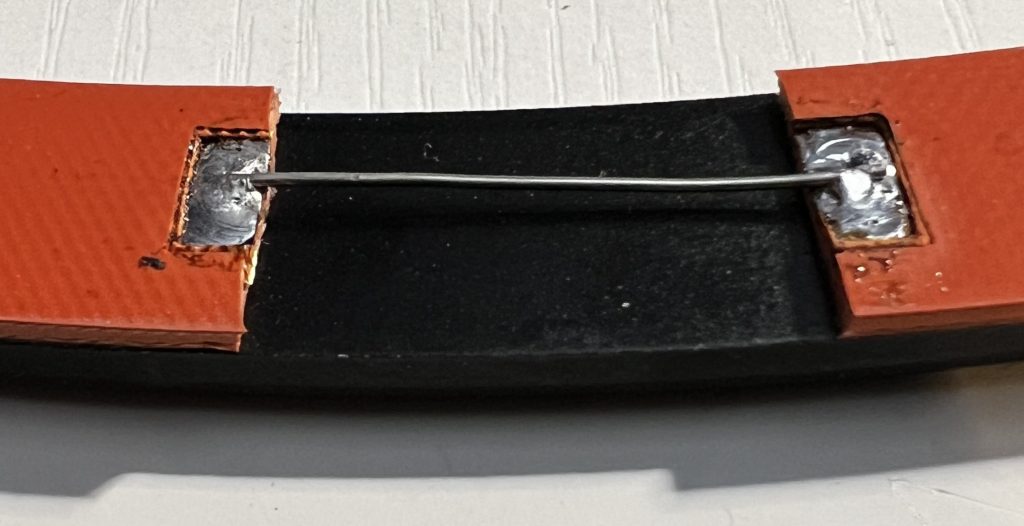 The heater elements firmly attached to the original corrector retaining ring
